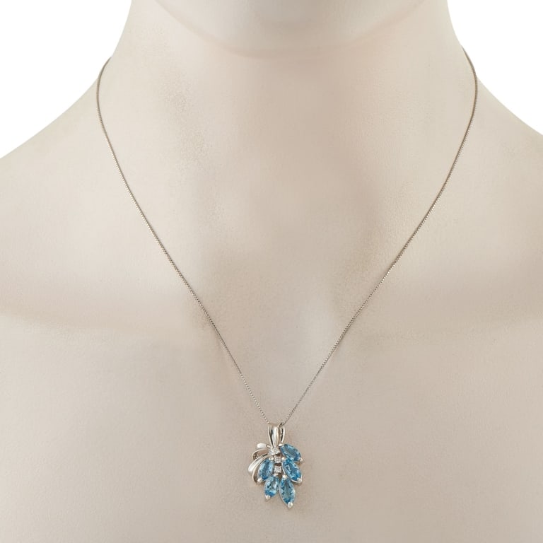 PLATINUM 0.08CT DIAMOND AND AQUAMARINE NECKLACE: Where clear light meets calm color, the result feels instinctively right, much like this necklace. It features a fine box chain in 850 platinum, fastened by a classic spring ring clasp. Hanging from i
