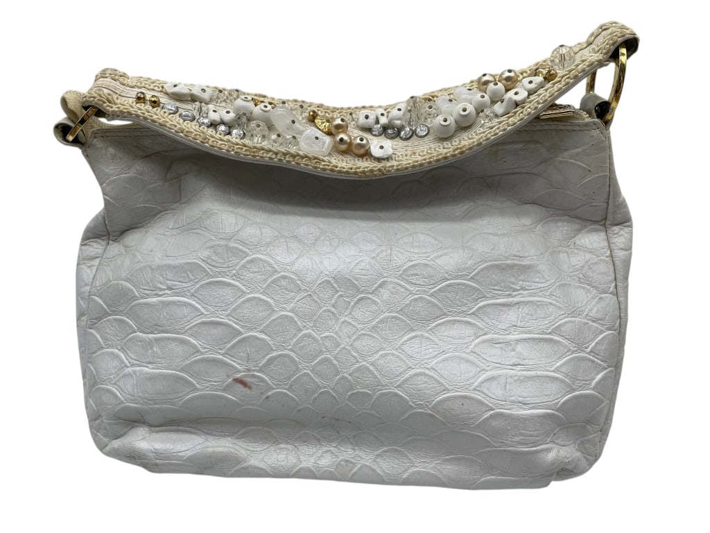 VINTAGE 80'S BRACCIALINI WHITE PLEATHER GEMS BAG: FLASHY handled bag by Beth Braccialini with zip pull logo White with some handing showing on the white and some color spots Handle is adorned in pearls and gems and a true 80's statement! Sold as is p