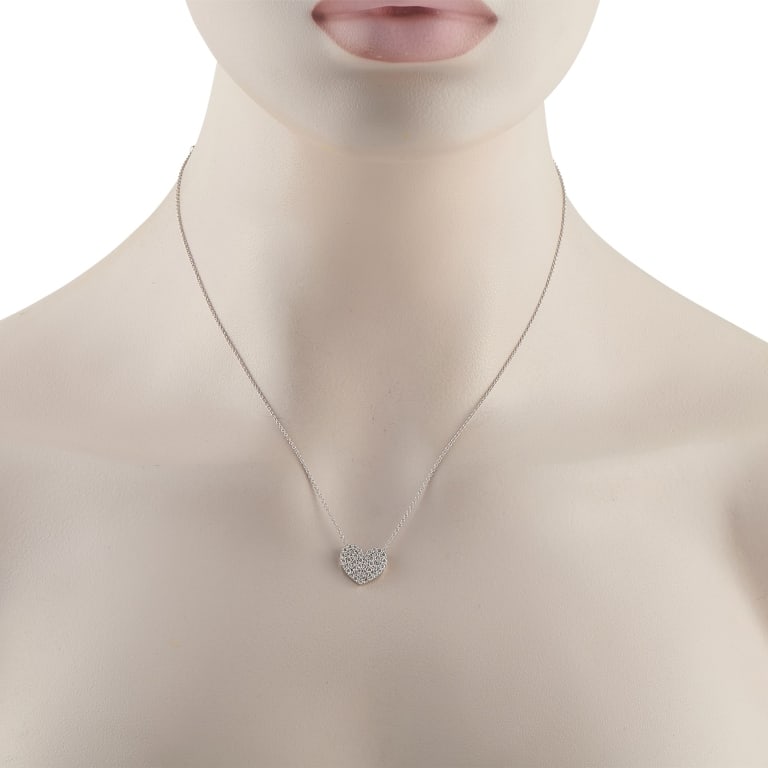 STUNNING 18K GOLD .54CT DIAMOND HEART NECKLACE: A sparkling heart-shaped pendant makes a statement at the center of this elegant necklace. Set in 18K White Gold, Diamonds totaling 0.54 carats make it simply stunning. The pendant measures 0.50 round