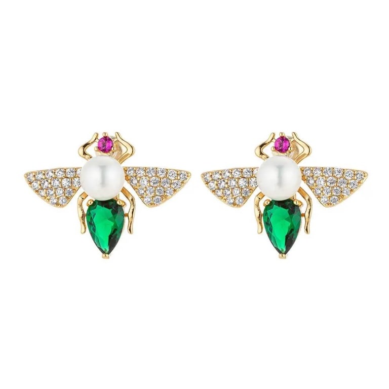 Eye Candy 14K GP Earrings with Emerald and Pearl A: Introducing the Eye Candy 14k GP earrings, a pair of gold-plated accessories designed with opulent craftsmanship. Shaped like bees, these earrings feature luminous pearls as bodies, vibrant green emer