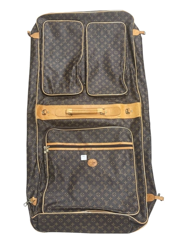 LOUIS VUITTON MONOGRAM GARMENT BAG 45": Vintage Louis Vuitton monogram canvas garment bag featuring the classic brown LV monogram exterior with natural vachetta leather trim, piping, straps, handle, zipper pulls, and multiple exterior stora