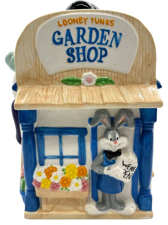 LOONEY TUNES GARDEN SHOP 1997 COOKIE JAR 13": Looney Tunes Garden Shop ceramic cookie jar, Warner Bros, 1997, features Bugs Bunny, Tweety, and Sylvester. Made in China. | Measures approximately 13" tall with lid, base approximately 8" wide. | Con