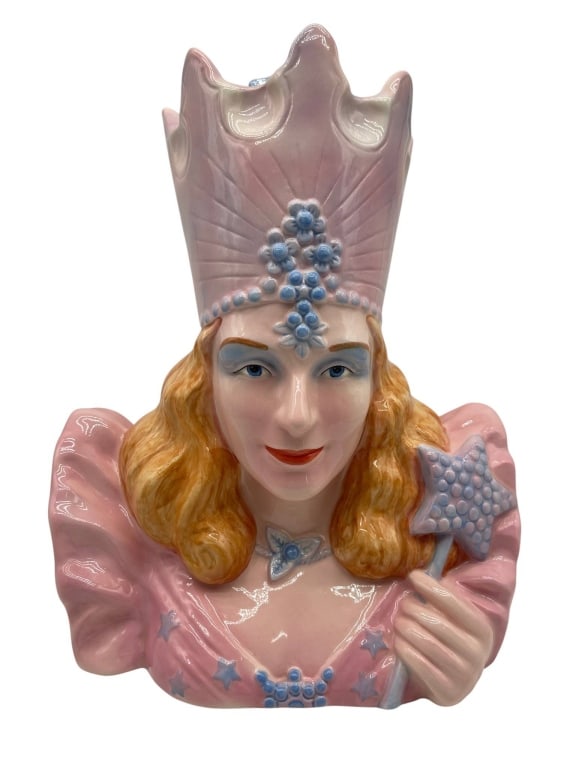 CERAMIC GLINDA THE GOOD WITCH COOKIE JAR 16": Glinda the Good Witch cookie jar made of ceramic with detailed hand-painted features. Features pink and blue colors, high crown, and star wand. Measures approximately 16" H x 13" W | | Shipping Availa