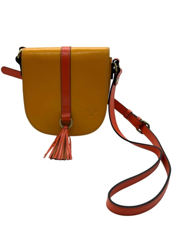PATRICIA NASH MUSTARD LEATHER CROSSBODY BAG 7.5": Patricia Nash leather crossbody bag featuring a rich mustard yellow body with coral-red leather accents, front vertical strap detail, tassel drop, brass-tone hardware, and adjustable shoulder strap. T