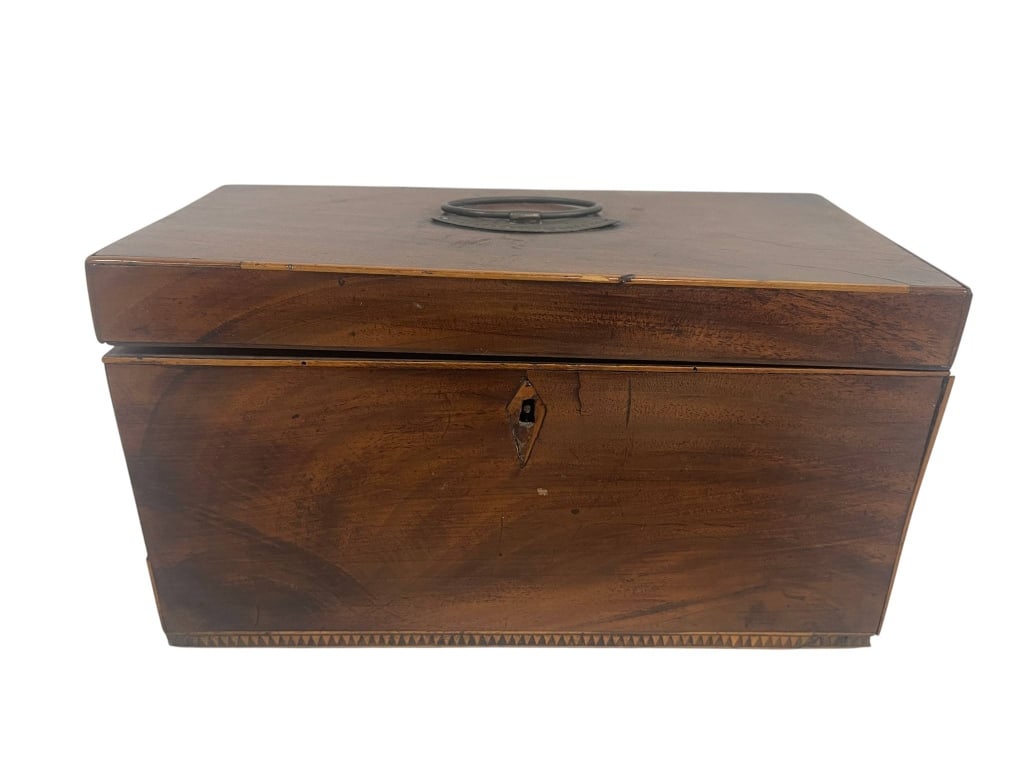 ANTIQUE MAHOGANY TEA CADDY BOX 10": Antique mahogany tea caddy box featuring a warm wood grain finish, hinged rectangular form, brass ring handle to the lid, front key escutcheon, and decorative inlaid-style border detail along the lowe