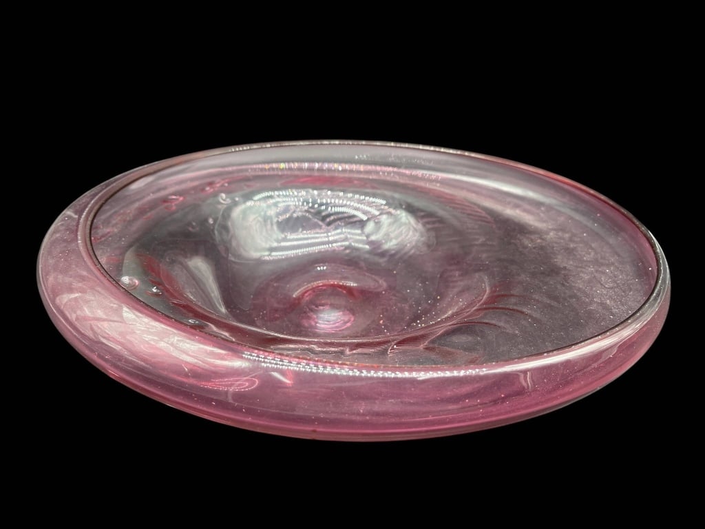 PINK HAND-BLOWN GLASS BOWL 13": Hand-blown glass bowl with pink coloring. The bowl features a round form with a smooth, slightly concave center and subtle swirling patterns. | | Measures approximately: 13" W | | By bidding on this l