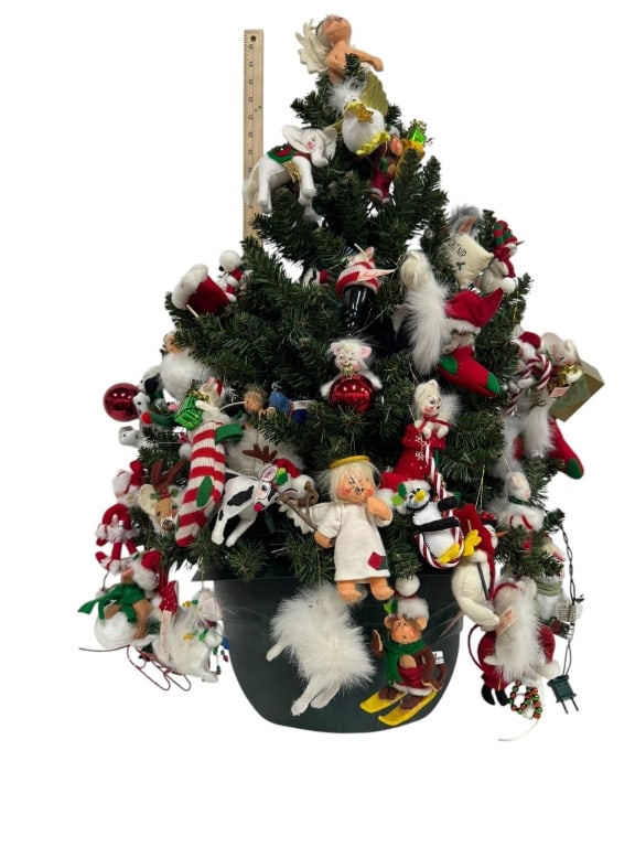 ARTIFICIAL CHRISTMAS TREE WITH ORNAMENTS: Artificial Christmas tree featuring a variety of plush and fabric holiday ornaments in a green pot. | | Shipping Available at www.DeJaVuAuctionShipping.com. | | By bidding in this auction you agree th