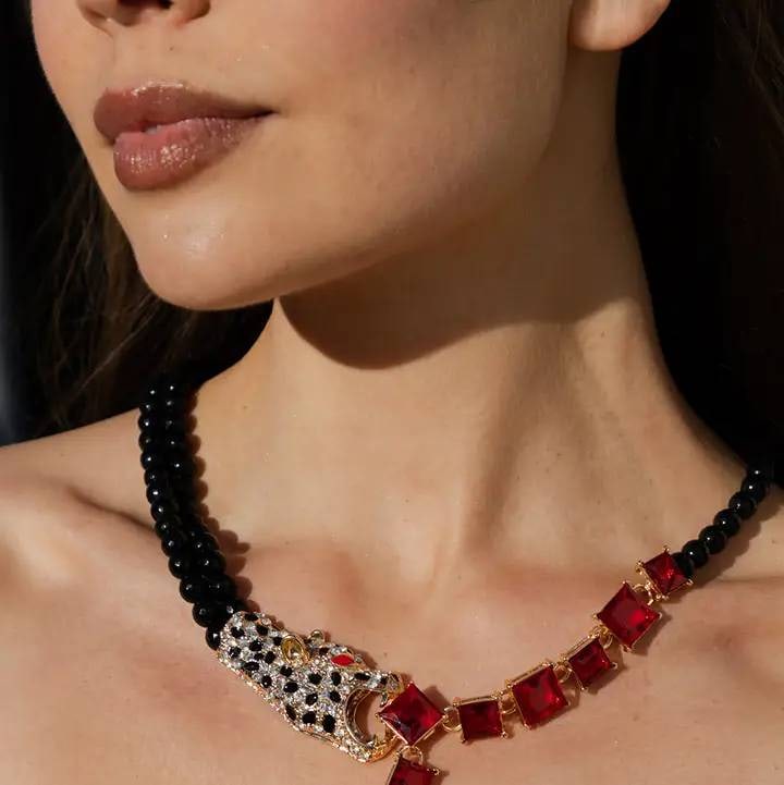 NEW EYE CANDY RED LEOPARD BROOCH NECKLACE: Red leopard brooch statement necklace by Eye Candy. Features agate beads and red glass crystal capping. Includes a jaguar motif brooch. Shipping available at www.DeJaVuAuctionShipping.com. By bidding 