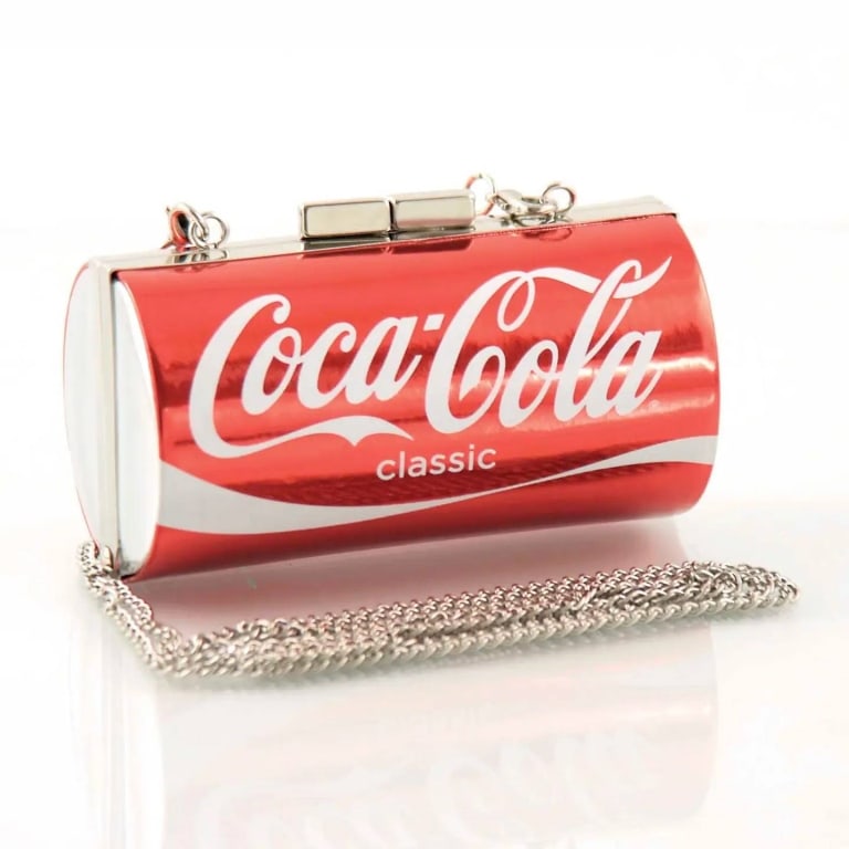COCA-COLA CAN BAG OFFICIALLY LICENSED NEW: Officially licensed Coca-Cola Can Bag with realistic soda can silhouette. Features metal clasp closure, fabric-lined interior, and a detachable 27" chain shoulder strap. Measures 4.5" L x 2.5" W x 2.5