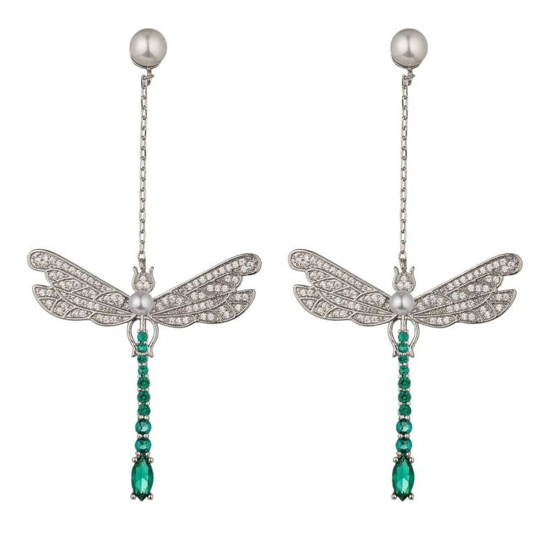 NEW EYE CANDY DRAGONFLY DROP CZ EARRINGS: NEW EYE CANDY Dragonfly Drop Earrings, crafted from 18k gold plated brass featuring CZ crystals. Earrings measure approximately 2 inches in length and have a pushback clasp. Shipping Available at www.