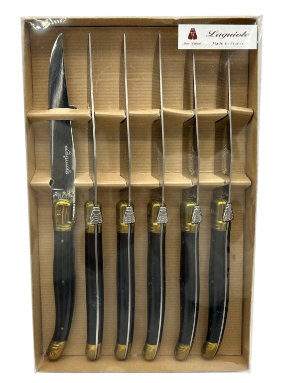 LAGUIOLE JEAN DUBOST FRENCH STEAK KNIFE SET IN BOX: Laguiole Jean Dubost steak knife set made in France, featuring six knives with polished stainless steel blades, black handles, brass-tone bolsters and end caps, and the classic Laguiole bee-form detai
