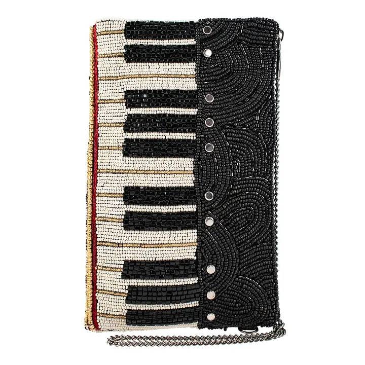NEW MARY FRANCES KEYS TO MY HEART BAG: Mary Frances Crossbody Phone Bags are the perfect multi-functional fashion statement! Slide your phone in the top slip pocket and store eye-glasses all your essentials in the side zip pocket. Easily f