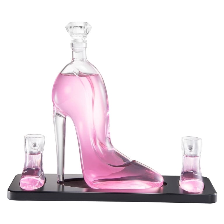 NEW IN BOX STILETTO HIGH HEEL DECANTER SET: New in box stiletto high heel decanter set. Includes a decanter shaped like a high heel shoe and matching accessories. Shipping Available at www.DeJaVuAuctionShipping.com By bidding in this auction yo
