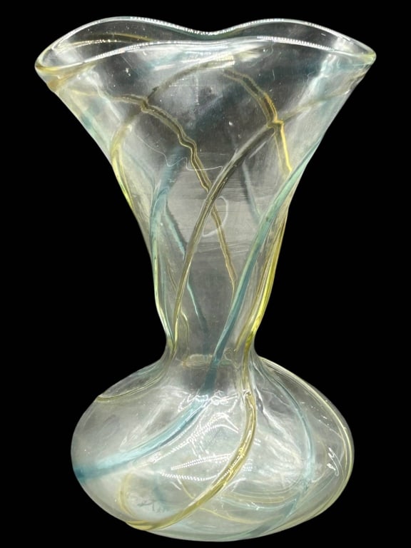 IRIDESCENT ART GLASS SWIRL VASE 12": Decorative iridescent art glass vase featuring a clear opalescent body with soft blue and yellow spiral ribbons worked through the glass. The piece has a flared ruffled rim, narrow waist, and rounded 