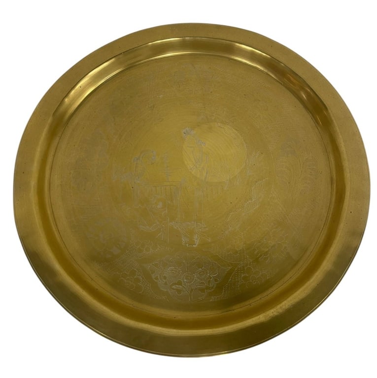 LARGE ROUND ENGRAVED BRASS TRAY 16": Large round brass tray with hand-engraved surface and decorative motifs. Measures approximately 16 inches in diameter. Excellent for use or display. Shipping Available at