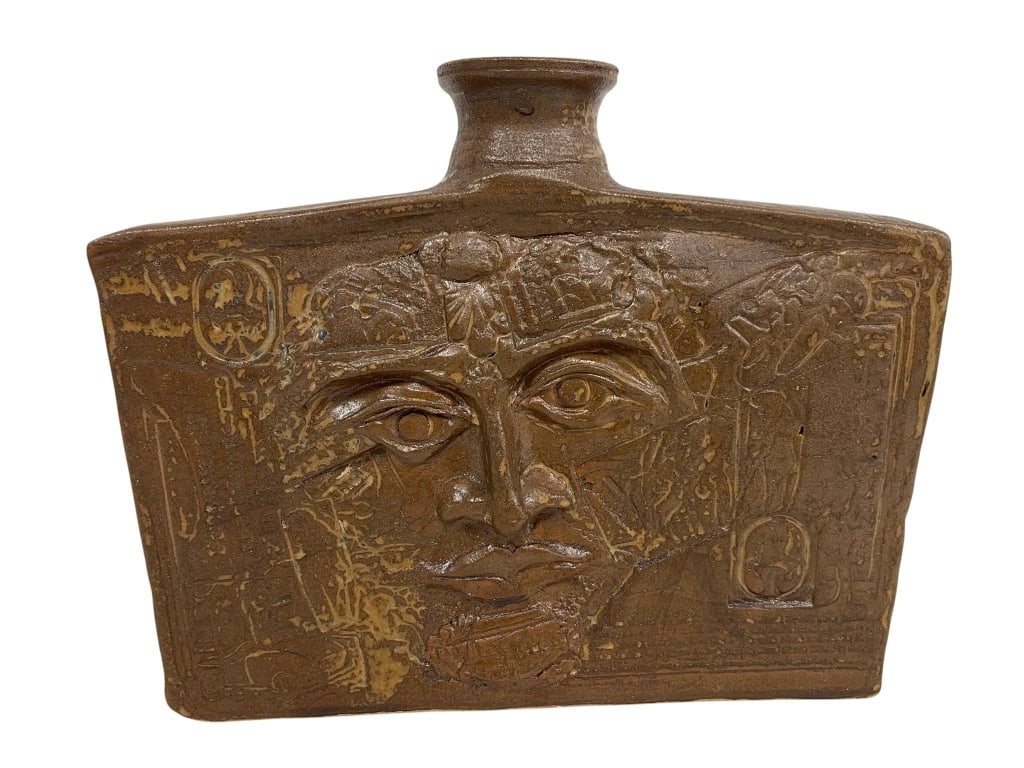 VINTAGE STUDIO POTTERY SLAB VASE 10": Vintage studio pottery slab-form vase or bottle featuring an Egyptian Revival inspired relief face design with incised hieroglyphic-style motifs throughout. The piece has a warm brown glazed finish wi