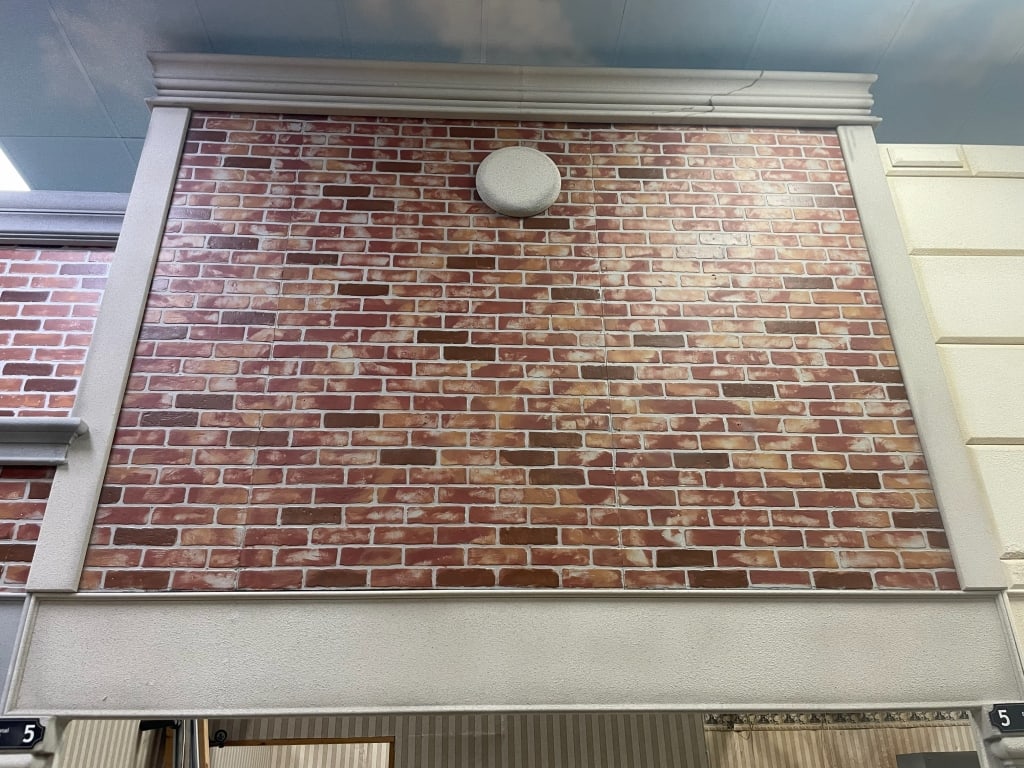NYC INDOOR CITY RED BRICK GRY BLDG FACADE SET 10FT: LOCATION: SE Corner. Single face facade. Must be removed. 57EC. Next to arched single facade. FACADES are sold as shown in pictures, for visualization the ceiling is 19 feet tall and the columns are 7