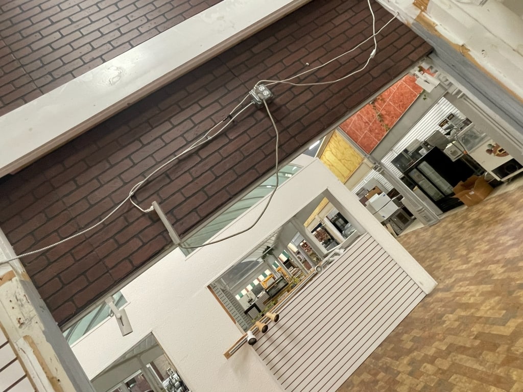 DARK BROWN BRICK FACADE WITH POWER WIRING ATTACHED (1 of 7)