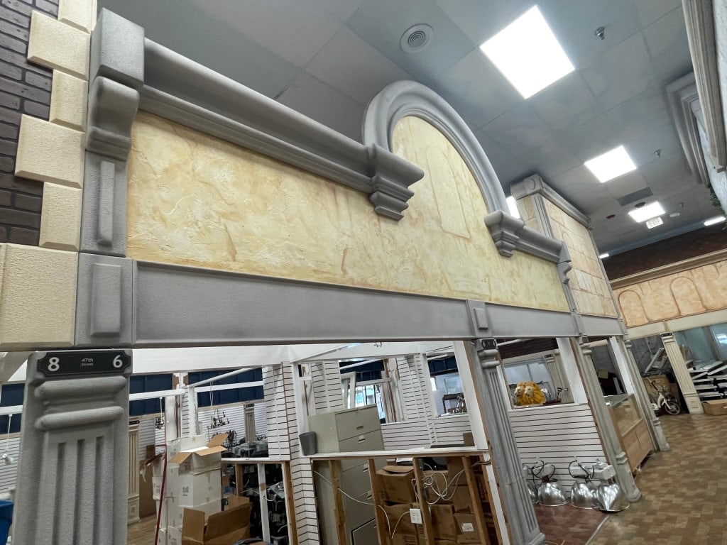 TRIPLE YELLOW BUILDING FACADE W/ 2 COLUMNS: FACADES are sold as shown in pictures, for visualization the ceiling is 19 feet tall and the columns are 7 foot. If the facade is parallel to column the measure will be approx from the column up. If t