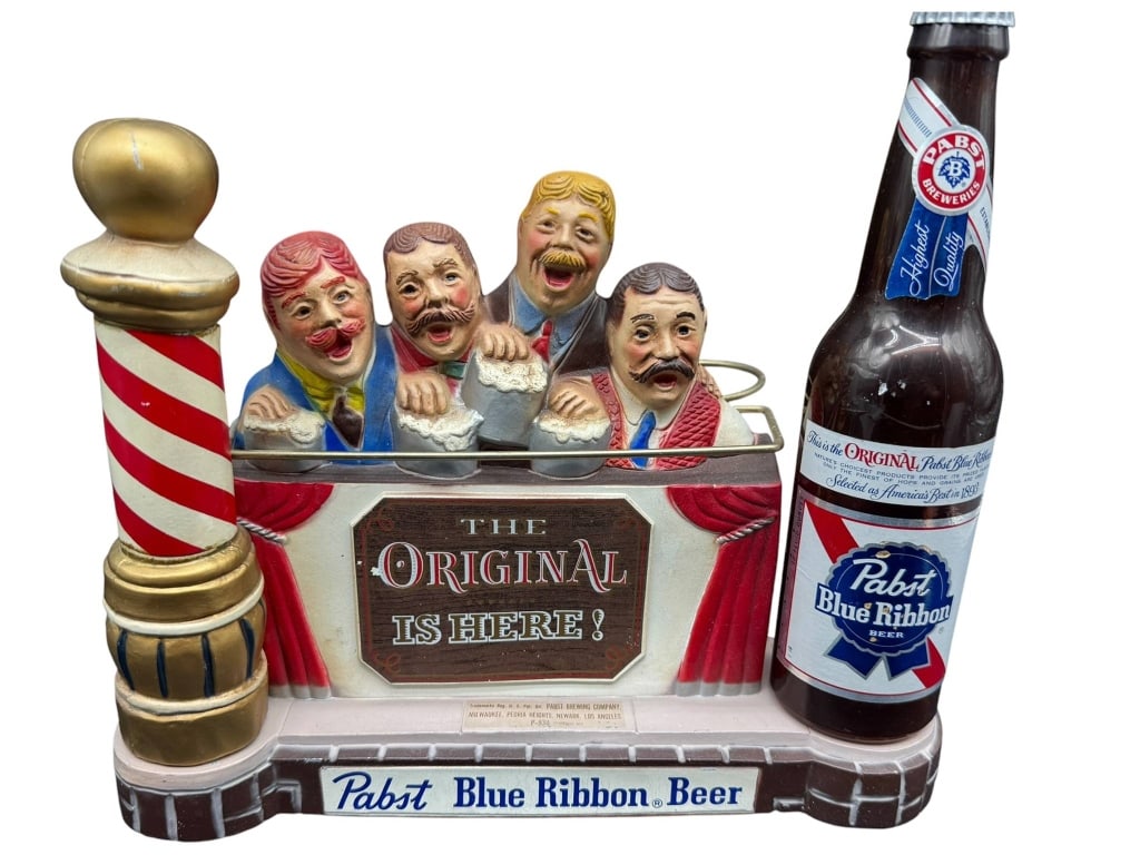 PABST BLUE RIBBON BEER DISPLAY HOLDER: Pabst Blue Ribbon Beer bar display with four figural characters, a replica bottle, and ring holders. Featuring "The Original Is Here!" on the front. Material: painted composite. Shipping Available at 
