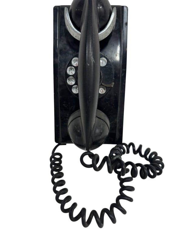 VTG BLACK ROTARY DIAL WALL TELEPHONE: Black rotary dial wall telephone with coiled cord. Features a rotary dial and handset, with metal accents. Standard size as shown by ruler. Shipping Available at www.DeJaVuAuctionShipping.com By biddi