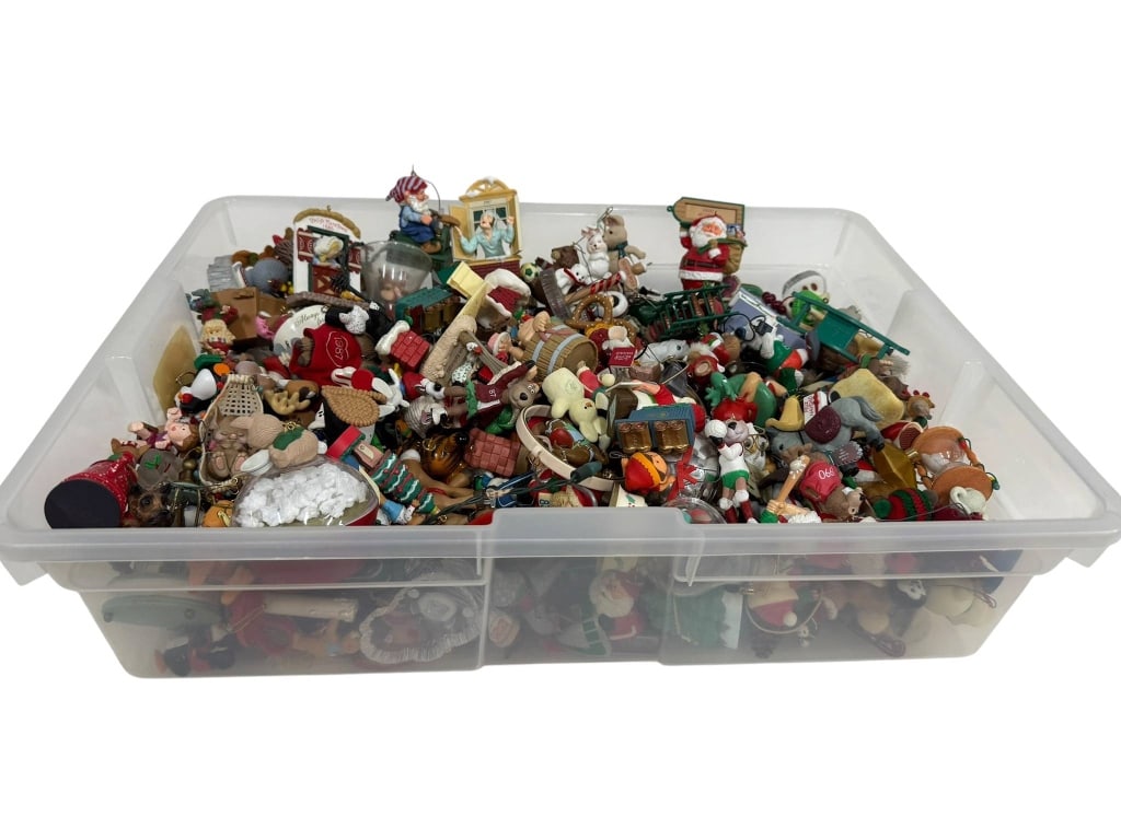 LARGE ASSORTMENT OF CHRISTMAS ORNAMENTS: Large lot containing a variety of Christmas ornaments featuring assorted holiday-themed figures and decorations. The assortment comes stored in a clear plastic tub. Shipping Available at www.DeJaVuAuc
