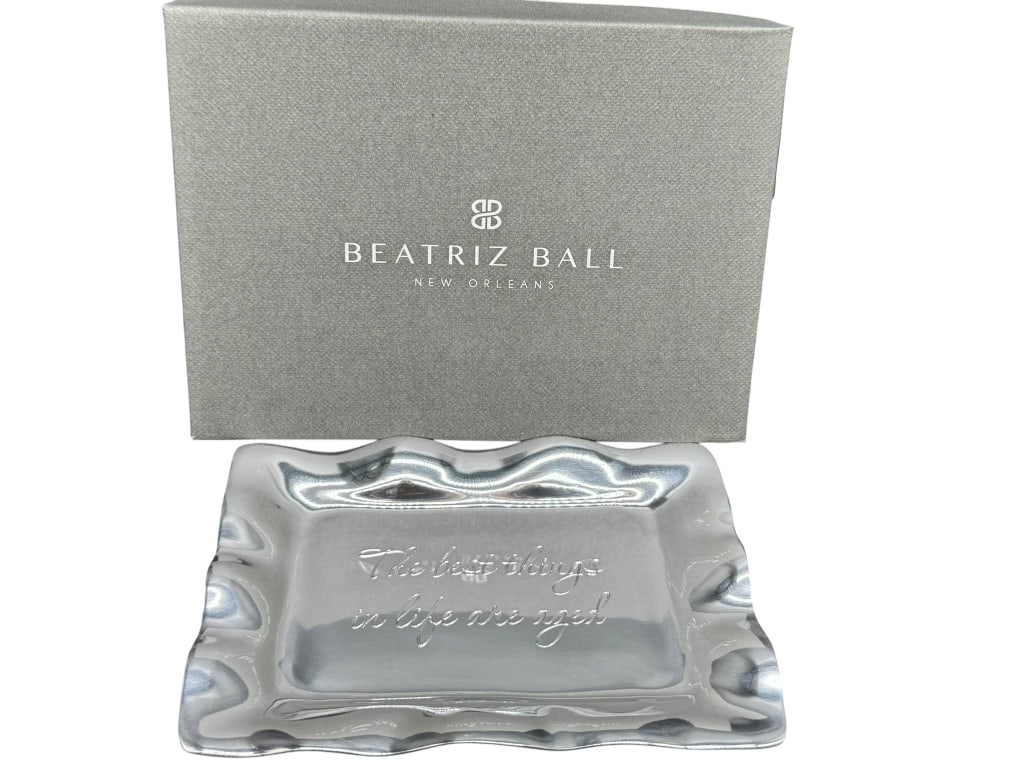 BEATRIZ BALL METAL TRAY WITH INSCRIPTION: Beatriz Ball metal tray featuring the inscription 'The best things in life are aged.' Tray is approximately 6.5 inches wide. Shipping Available at www.DeJaVuAuctionShipping.com By bidding in this auct