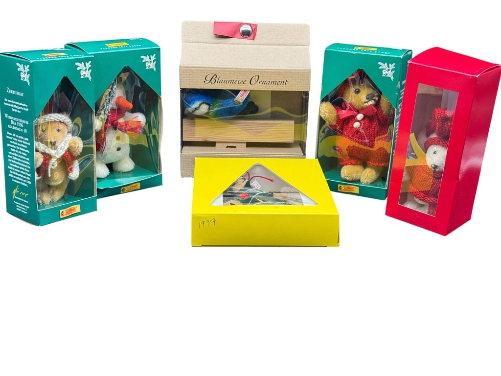 STEIFF MINIATURE PLUSH ORNAMENT LOT: Six Steiff miniature plush Christmas ornaments, each in original packaging. Features various Christmas-themed designs. Shipping Available at www.DeJaVuAuctionShipping.com By bidding in this auction yo