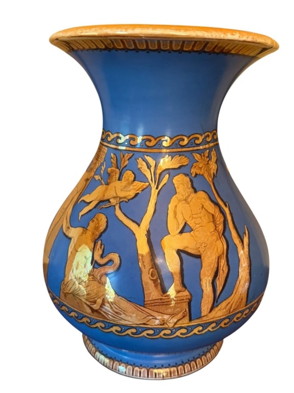 ANTIQUED STYLE BLUE AND GOLD FIGURAL VASE: Striking blue ceramic vase with gold classical figures and motifs, likely modern but inspired by ancient Greek designs. Features detailed relief of seated and standing figures among trees. Measures ap