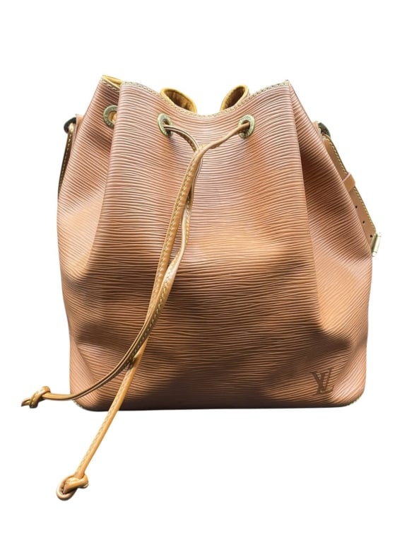 VINTAGE LOUIS VUITTON NOÉ EPI LEATHER DRAWSTRING 1: Purchased from France, Louis Vuitton Noé bucket bag in tan Epi leather, featuring a drawstring closure and adjustable shoulder strap in brown. Signature LV monogram embossed on the exterior. Measures