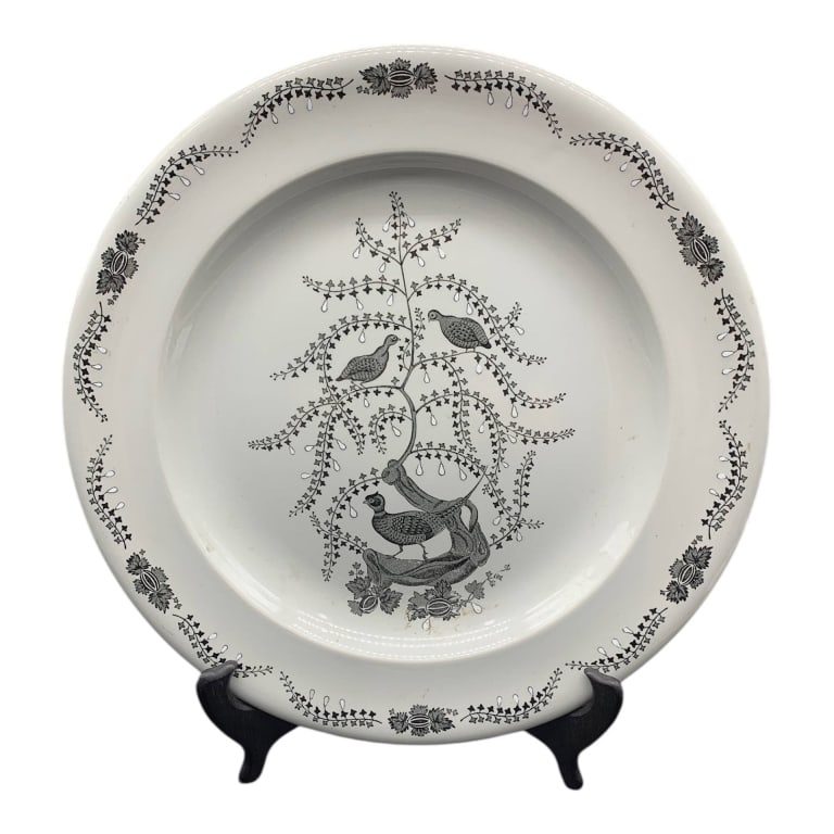 WEDGWOOD ENGLAND DINNER PLATE FLORAL BIRD 12.5": Wedgwood of Etruria & Barlaston dinner plate, made in England. Features a black floral and bird motif with decorative border. Classic collectible English pottery piece, ideal for display or use. Overa