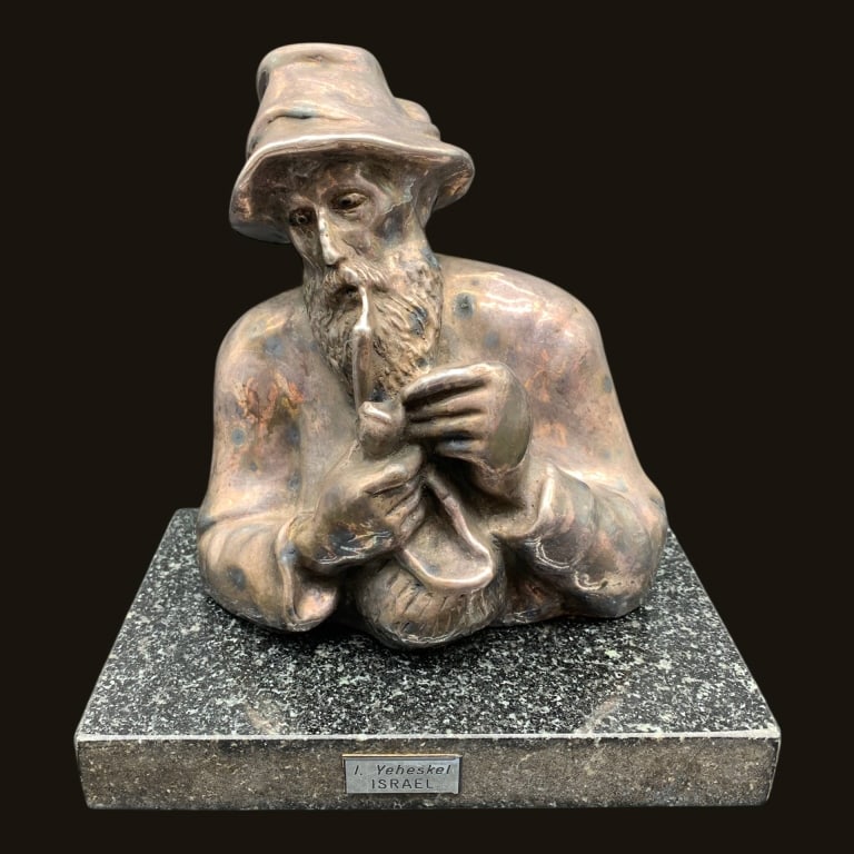 YEHEZKEL ISRAEL BRONZE SCULPTURE 6": Charming vintage sculpture by Israeli artist I. Yeheskel depicting a contemplative bearded man smoking a pipe while reading from an open book. Executed in a stylized modernist form with expressive fac