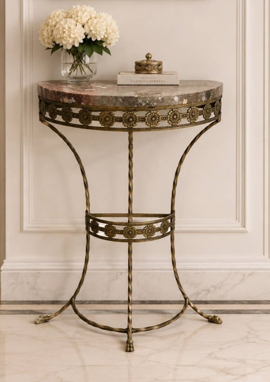 GILT METAL MARBLE-TOP DEMILUNE PEDESTAL TABLE 32": Elegant pedestal table with a round natural marble top, set on a decorative gilt metal base with twisted legs and floral accents. Dimensions are approximately 32" H X 20.5" (marble diameter) X 10" Dep