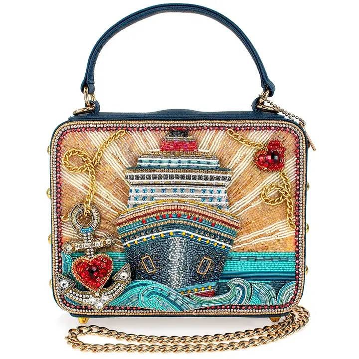 NEW MARY FRANCE FULL STEAM AHEAD BAG: The 'Full Steam Ahead' handbag takes you on a glamorous voyage with its intricately beaded cruise ship design and sparkling ocean waves. With bold nautical elements like a jeweled anchor and radiant s