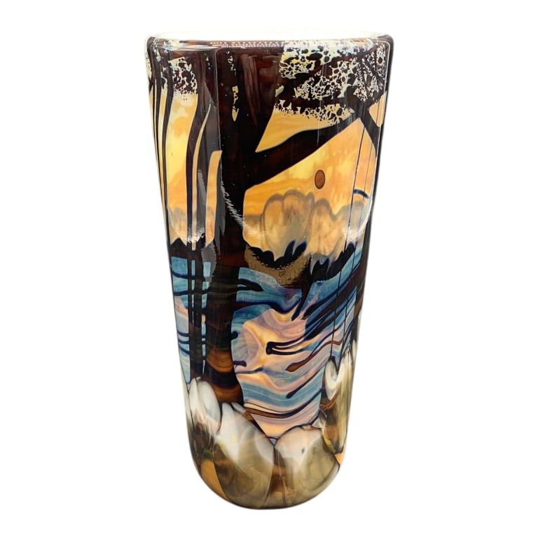 RICH MILLER BLOWN ART GLASS VASE 10.5": Artist Rich Miller glass vase featuring a landscape motif with tall trees, horizon details, and multicolor design. The vase is blown glass, standing approximately 10.5 inches tall. | | Location-pit