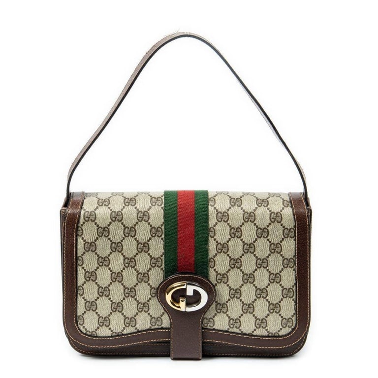 GUCCI GG SUPREME MONOGRAM SHOULDER BAG: Vintage Gucci shoulder bag featuring GG Supreme canvas with brown leather trim, signature red and green web stripe, and gold-tone hardware. Made in Italy by Gucci, marked 'Brevetatto.' Classic and col
