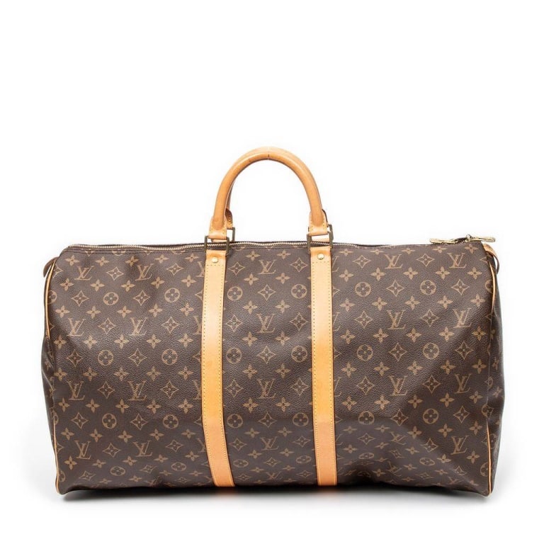 LOUIS VUITTON KEEPALL 55 MONOGRAM CANVAS BAG: Classic Louis Vuitton Keepall 55 duffle bag in monogram coated canvas with leather trim and handles. Features spacious interior, gold-tone hardware, and double zip closure. In good pre-owned condition