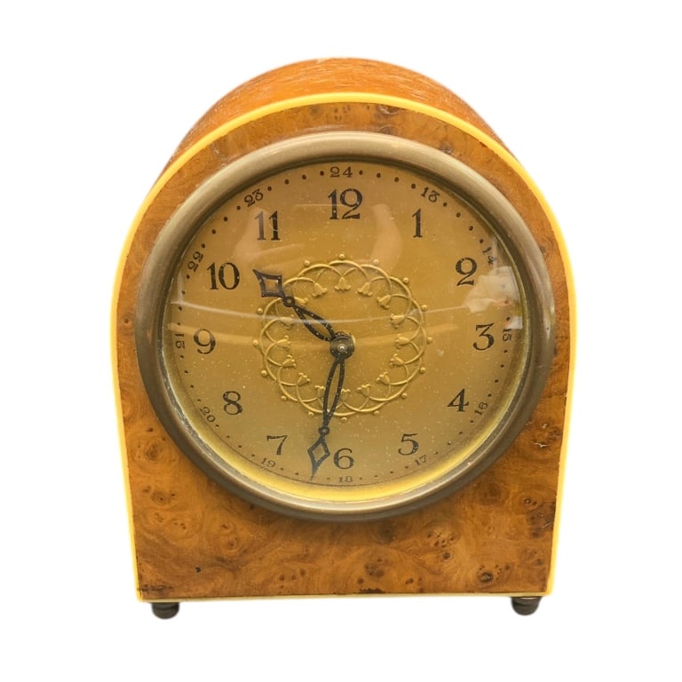VINTAGE BURLWOOD MANTEL CLOCK WITH BRASS FACE 6": Classic vintage mantel clock featuring a wood case with distinct burl wood grain, a brass face with decorative hands. Approximately 6 inches tall, it stands on four small feet. Authentic piece for col