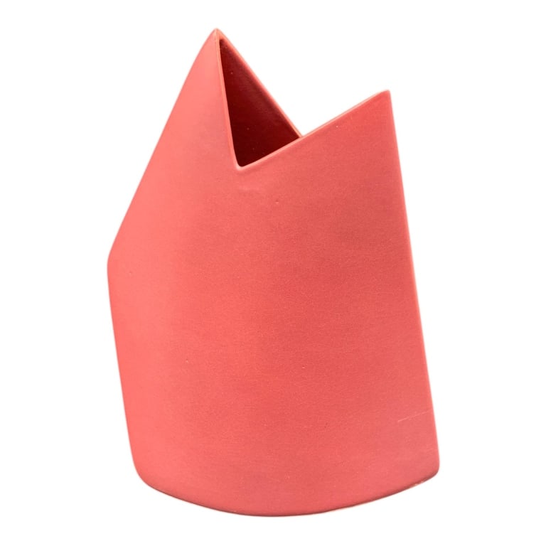 RED CERAMIC VASE SIGNED BY ARTIST 10": This is a red ceramic vase with a modern, angular design. The vase is signed by the artist on the underside. The measurement shows a height of approximately 10 inches. Indecipherable artist signature.