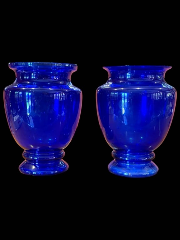 LARGE COBALT BLUE GLASS VASES 13": Striking pair of hand-blown cobalt blue glass vases, each approximately 13 inches tall and 7 inches wide. Vases feature a bold color and classic rounded baluster form, ideal as statement decor or flor