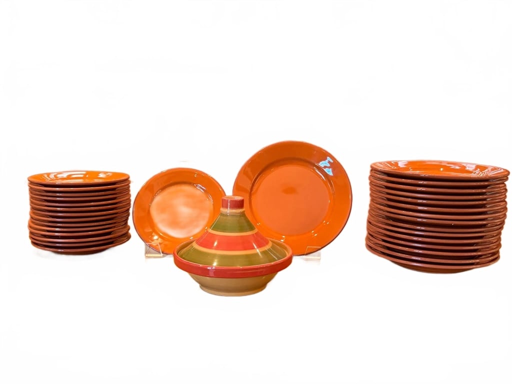 32 PCS VAL DO SOL PORTUGAL CERAMIC DINNERWARE: Orange ceramic dinnerware by Val do Sol, made in Portugal. Includes dinner and salad plates, bowls, and a lidded Moroccan tagine serving piece. Approx. 32 pieces included in set. Smaller dinner plates