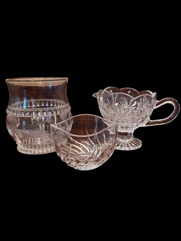 VINTAGE CUT GLASSWARE LOT 5": Three vintage cut glass pieces, including a creamer, sugar bowl, and small vase. Detailed patterns adorn each item. The tallest piece measures approximately 5". Excellent clarity and decorative appeal