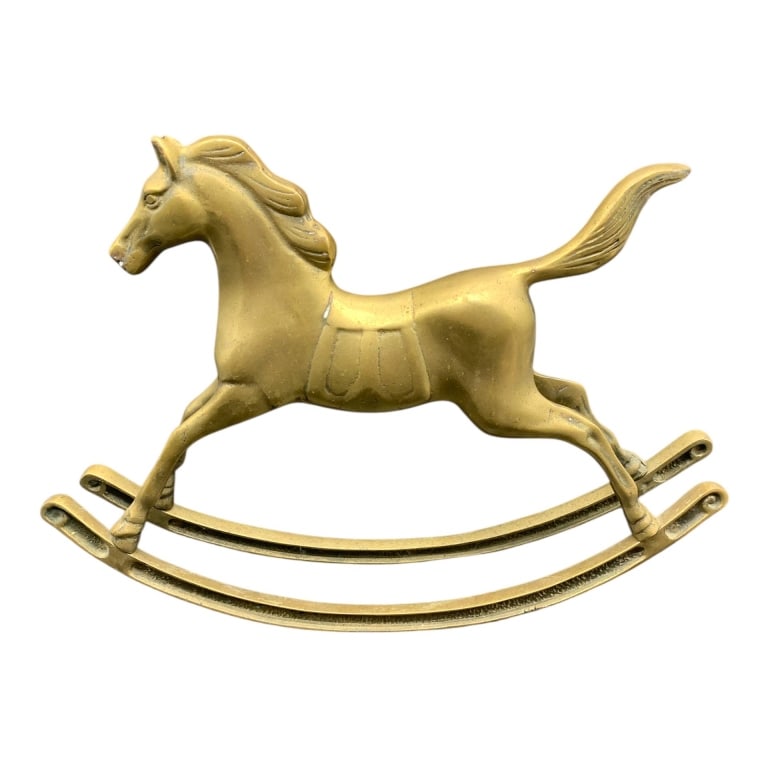 VINTAGE BRASS ROCKING HORSE FIGURINE 10.5": Vintage brass rocking horse figurine, featuring an elegant design with smooth lines. Measures approximately 6.5 inches tall, perfect for décor or as a collectible. Shows gentle patina typical of vint
