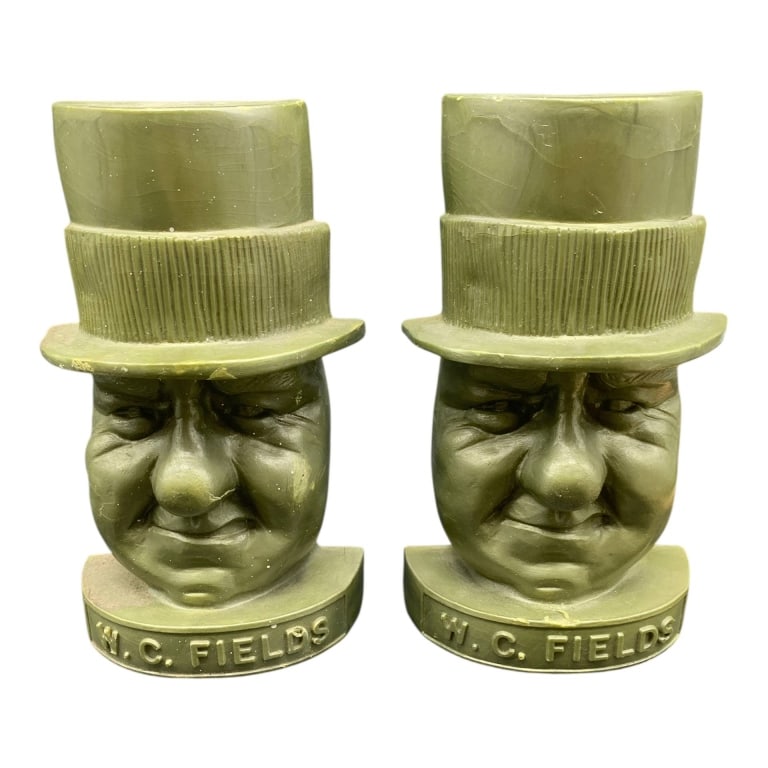 PAIR W.C. FIELDS BUST BOOKENDS RESIN 7": Resin bookends featuring the likeness of W.C. Fields, each measuring approximately 7 inches in height. Both pieces show molded detail and have 'W.C. Fields' inscribed at the base. Good condition,