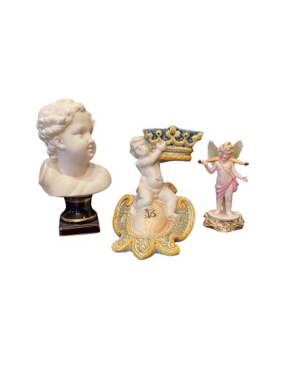 3 CLASSICAL PORCELAIN CHERUB FIGURINES 5": Three vintage porcelain cherub figurines, including a cherub bust, a cherub with a crown, and a winged cherub with flute. Heights range up to 5 inches. Good condition, colorful details, ideal for