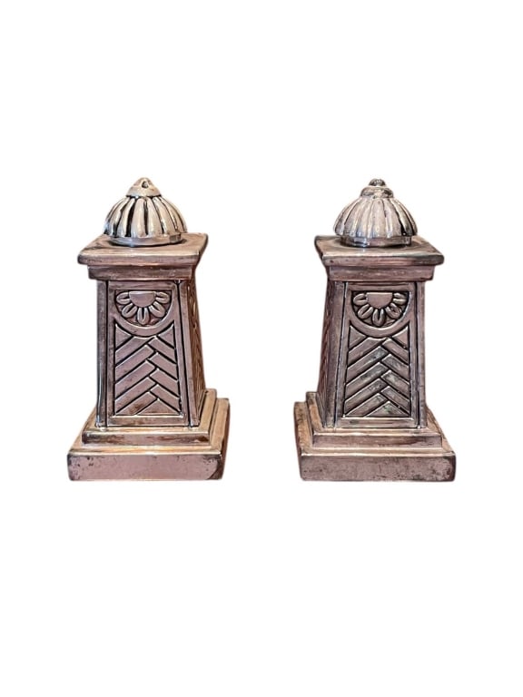 VINTAGE SILVER SALT SHAKERS 3": Vintage silver salt shakers with a classical architectural design. Each measures approximately 3.5 inches tall. Marked 'Made in China' on the base. Decorative and functional for tabletop use.