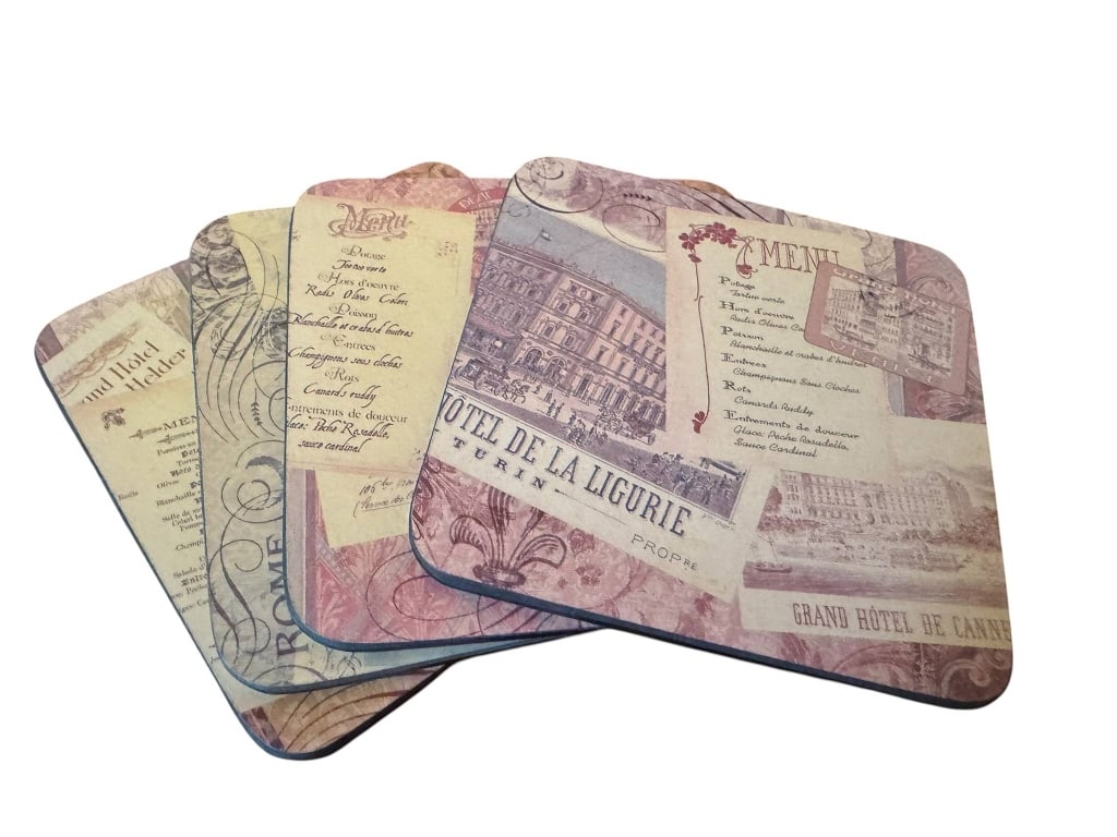 FOUR VINTAGE STYLE COASTERS: Four coasters featuring vintage-inspired European hotel and menu designs. Each coaster has a distinct print with a nostalgic feel, perfect for adding a decorative touch to your table. Good condition w