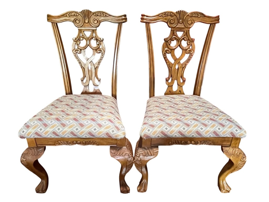 PAIR OF CARVED ROCOCO STYLE SIDE CHAIRS 42": Elegant pair of carved wood dining chairs with decorative openwork backs and cabriole legs. Seats are upholstered in multicolor patterned fabric. Fine craftsmanship, ideal for classic dining or accent