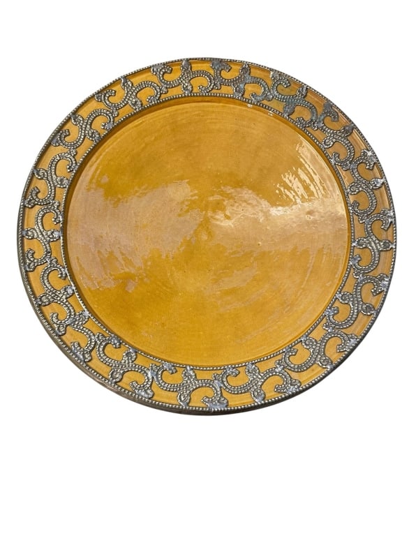 LARGE YELLOW CERAMIC CHARGER 17": Large ceramic charger featuring a striking yellow glaze and a decorative border in relief with intricate patterns. Footed base and substantial diameter, approx. 17 inches wide and 3 inches tall. Under