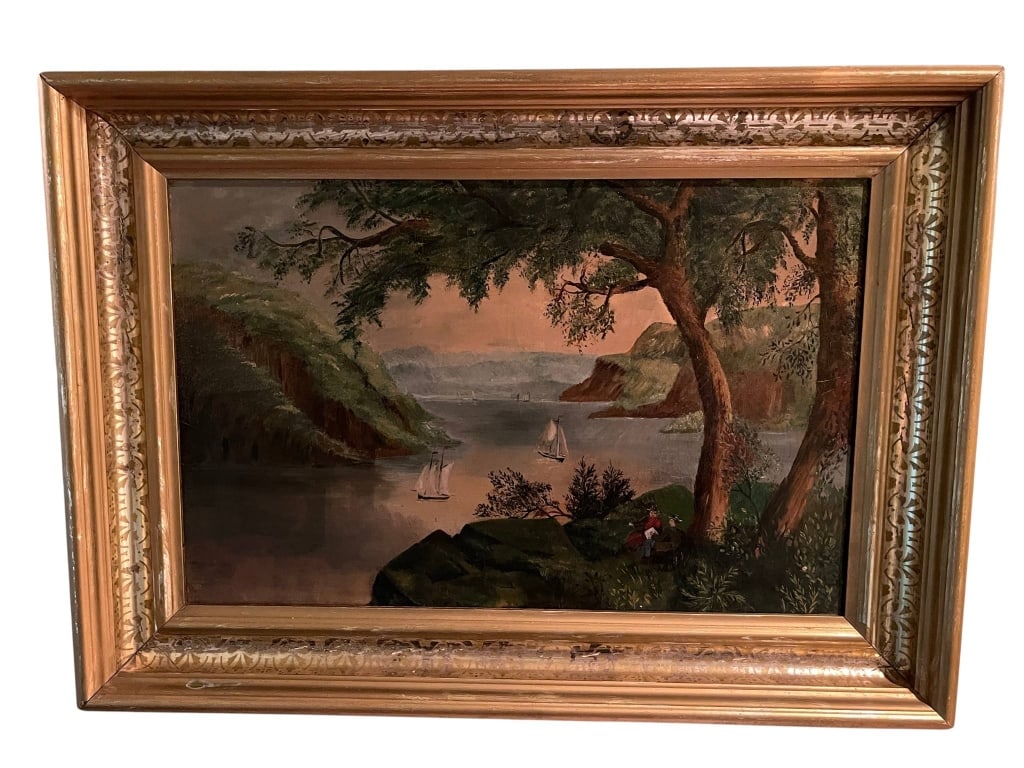 FRAMED LANDSCAPE OIL PAINTING ON CANVAS 24.5": Original oil painting on canvas depicts a serene landscape with sailing boats on a river bordered by lush green hills and a large tree in the foreground. The painting is housed in a gold-tone wooden f
